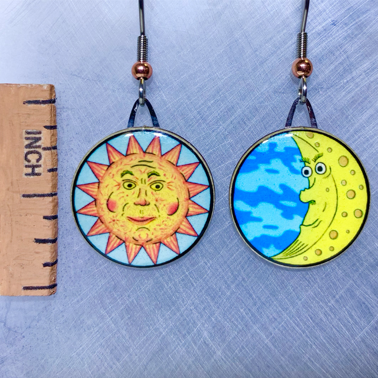 Picture shown is of 1 inch tall pair of earrings of Sun & Moon.