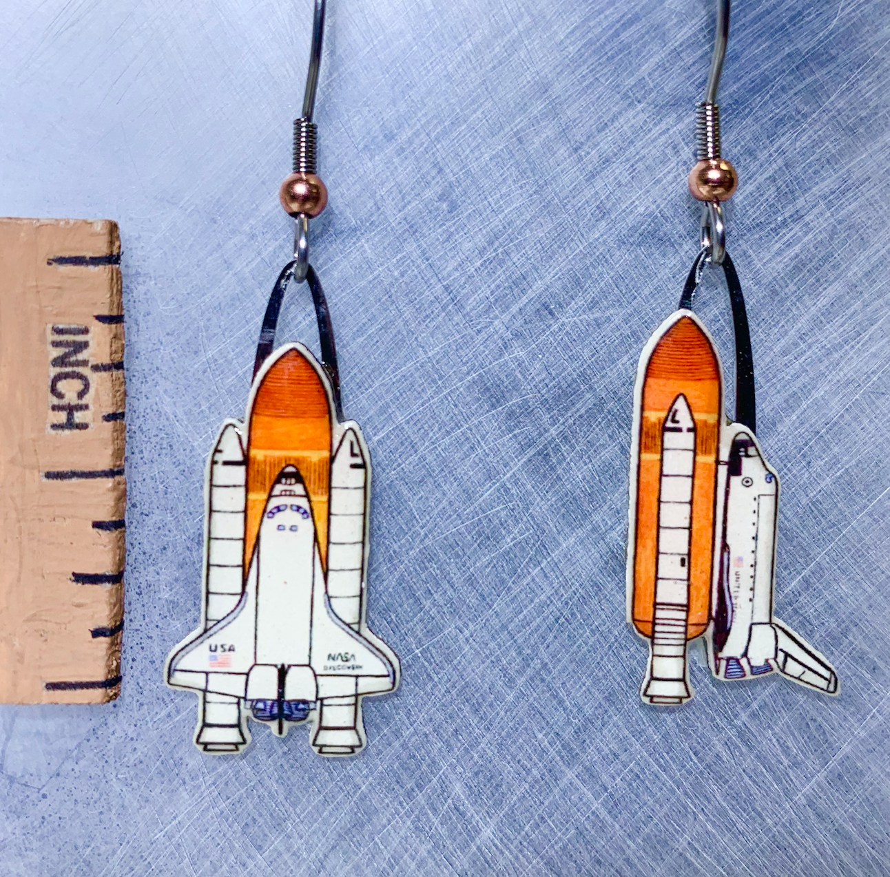 Picture shown is of 1 inch tall pair of earrings of the Space Shuttle.