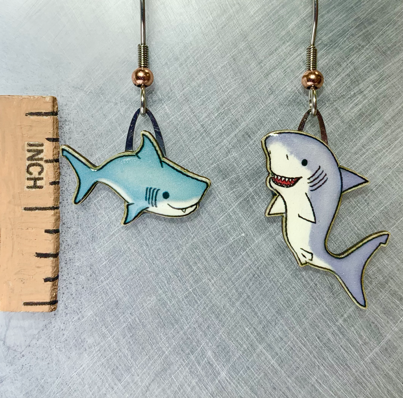 Picture shown is of 1 inch tall pair of earrings of the marine animal the Baby Shark & Mama.