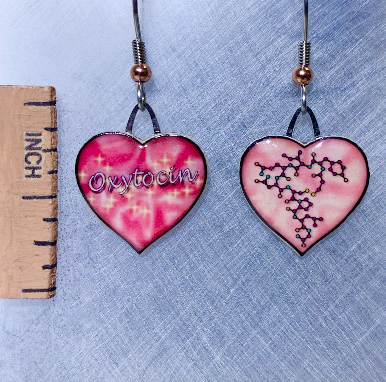 Picture shown is of 1 inch tall pair of earrings of Oxytocin.