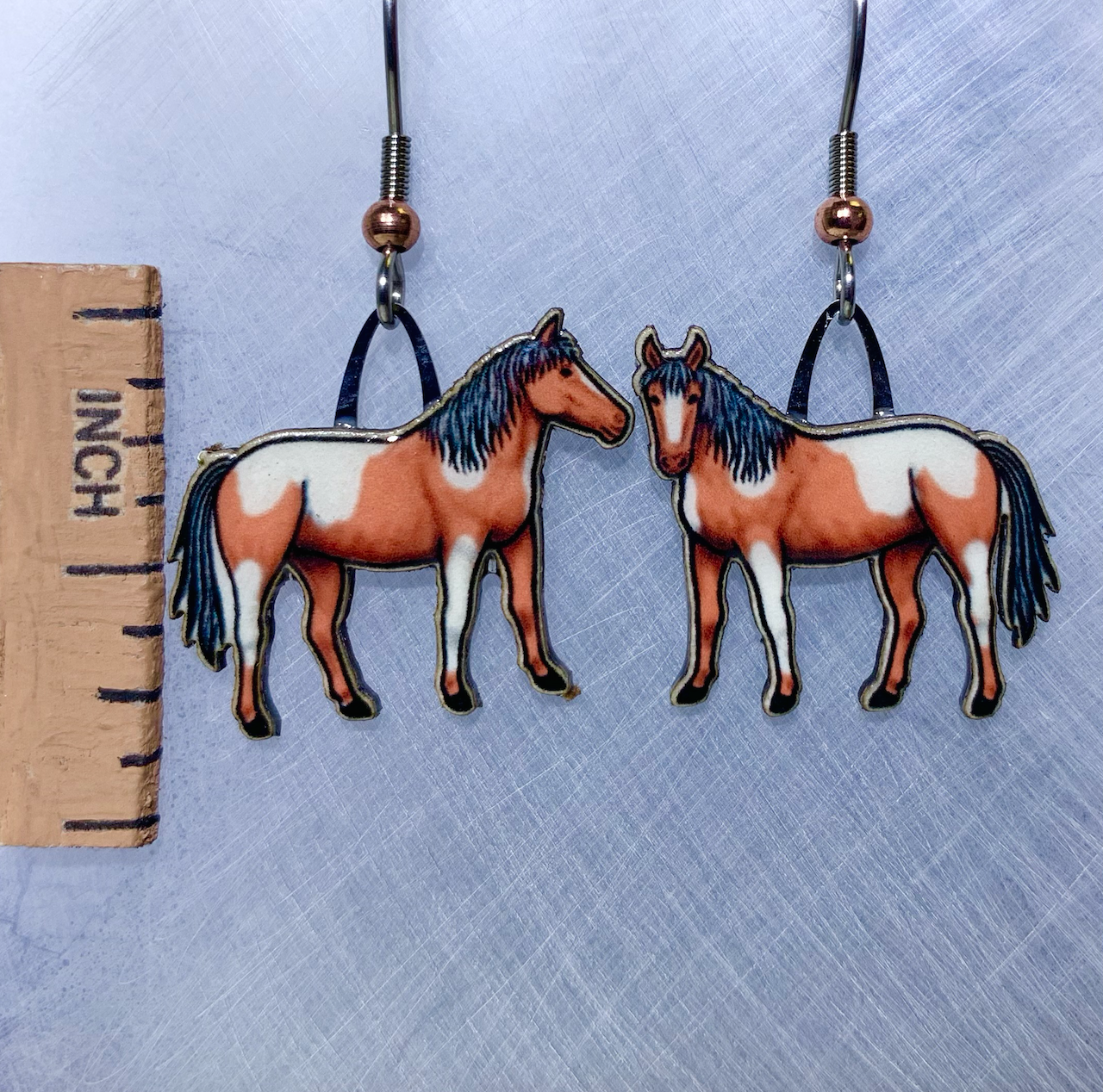 Picture shown is of 1 inch tall pair of earrings of the animal the Wild Pony.