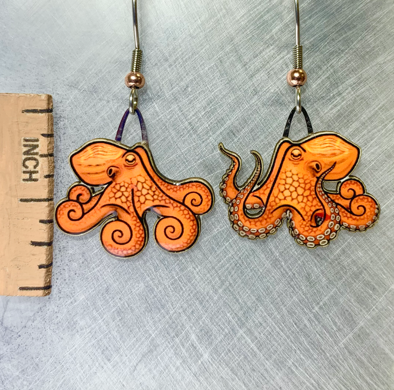 Picture shown is of 1 inch tall pair of earrings of the marine animal the Octopus.