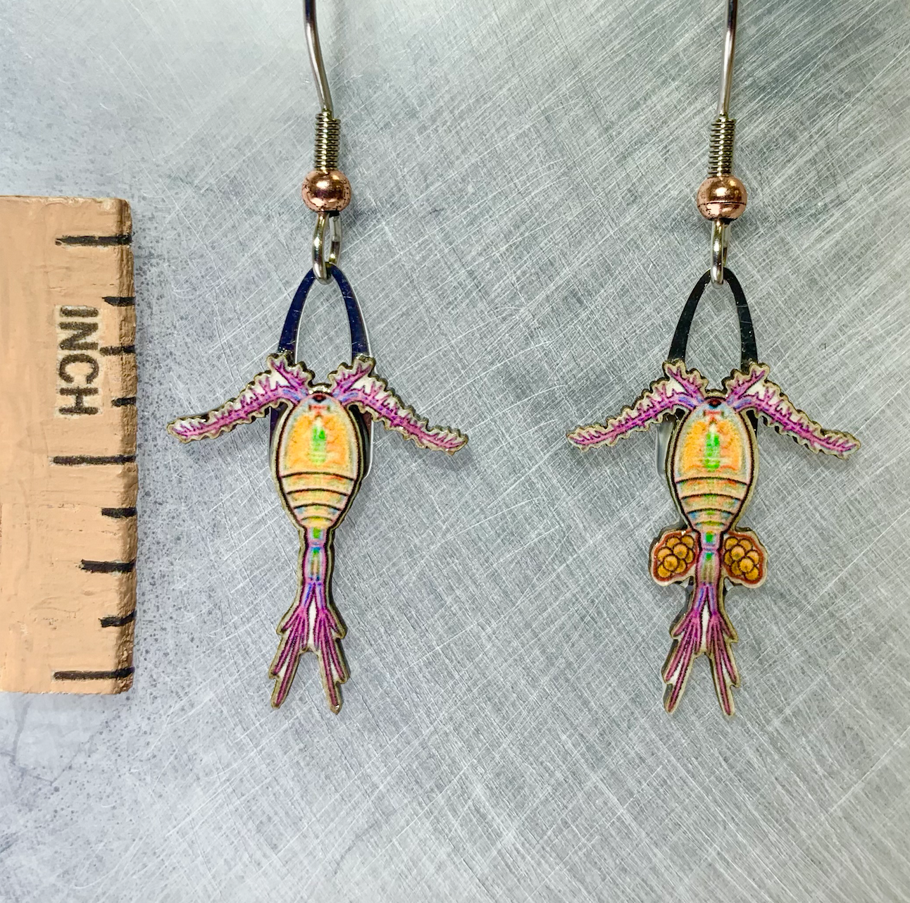 Picture shown is of 1 inch tall pair of earrings of the marine animal the Copepod (Zooplankton).