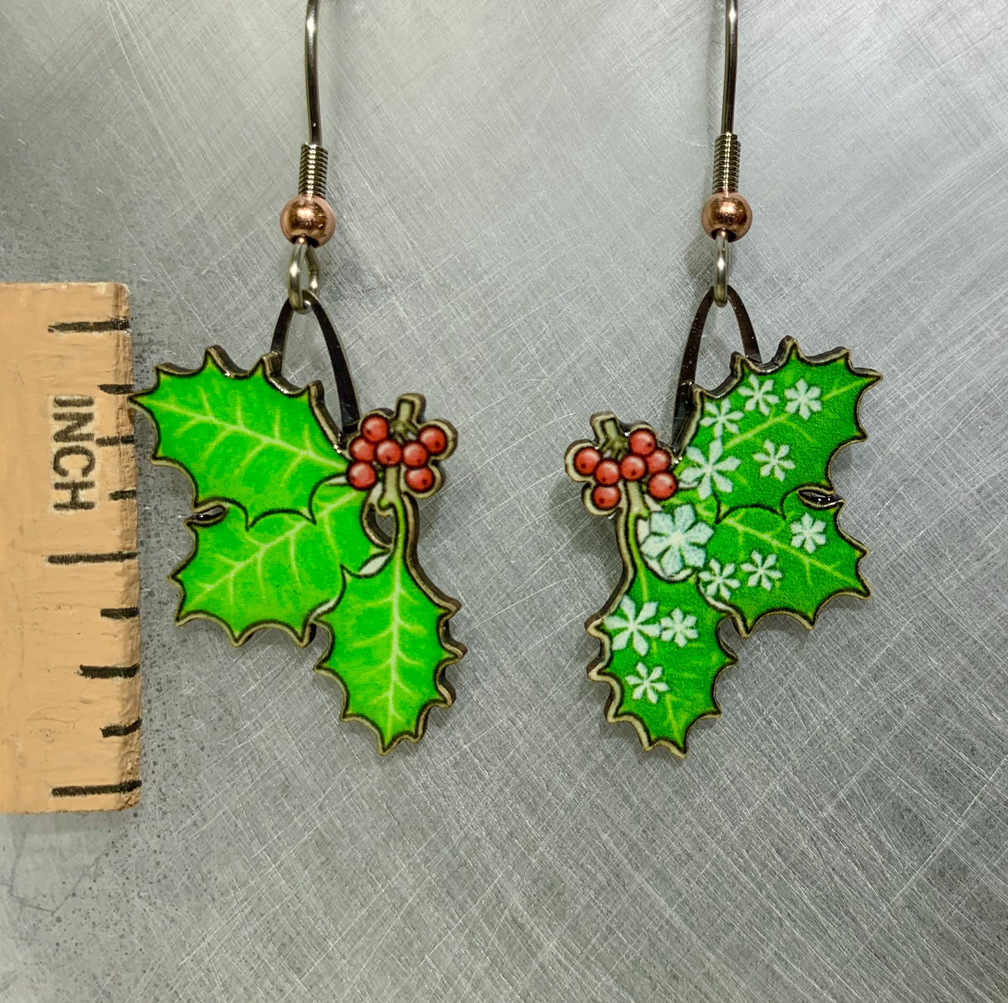 Picture shown is of 1 inch tall pair of earrings of Holly Leaves.
