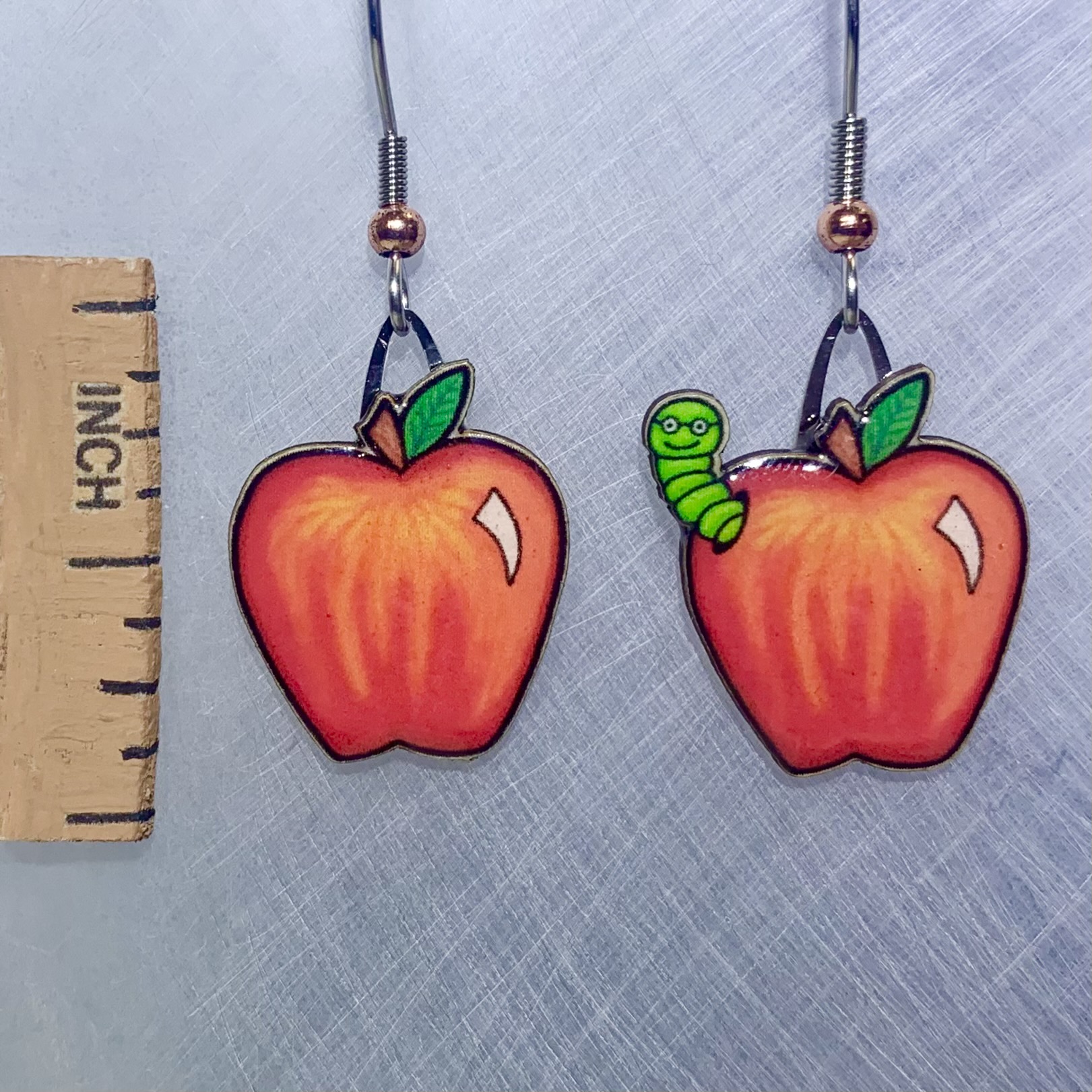 Picture shown is of 1 inch tall pair of earrings of Apple & Worm.