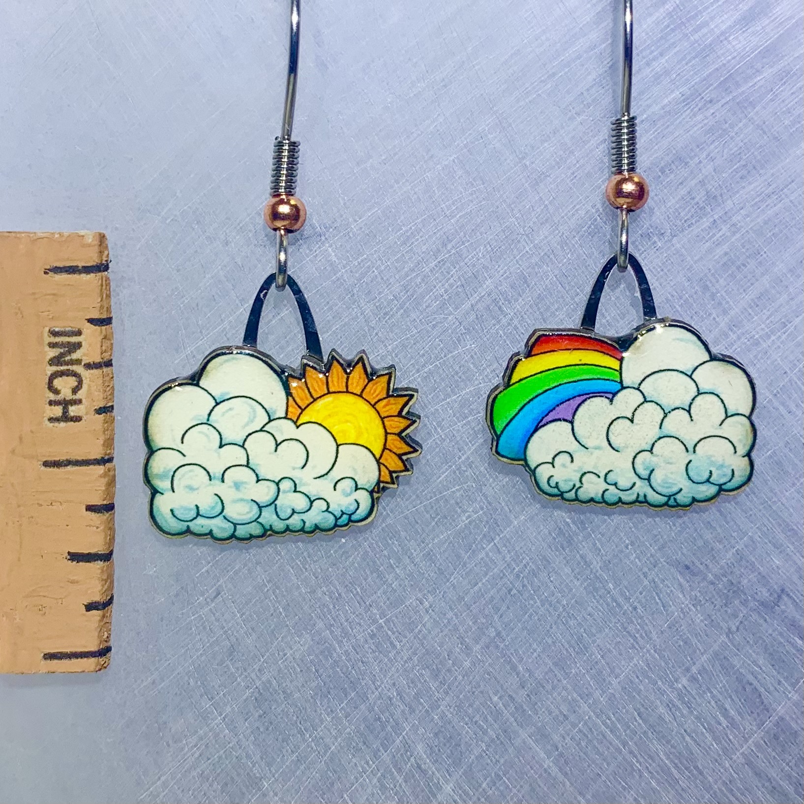 Picture shown is of 1 inch tall pair of earrings of Clouds.