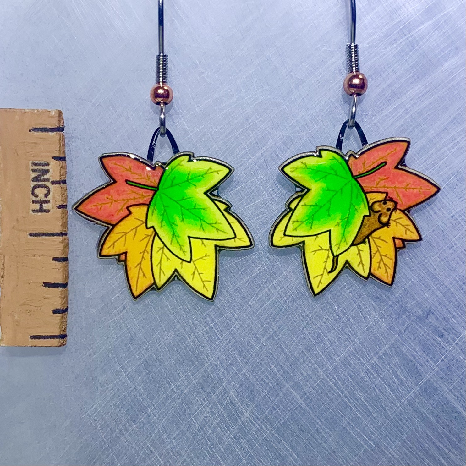 Picture shown is of 1 inch tall pair of earrings of Fall Leaves.