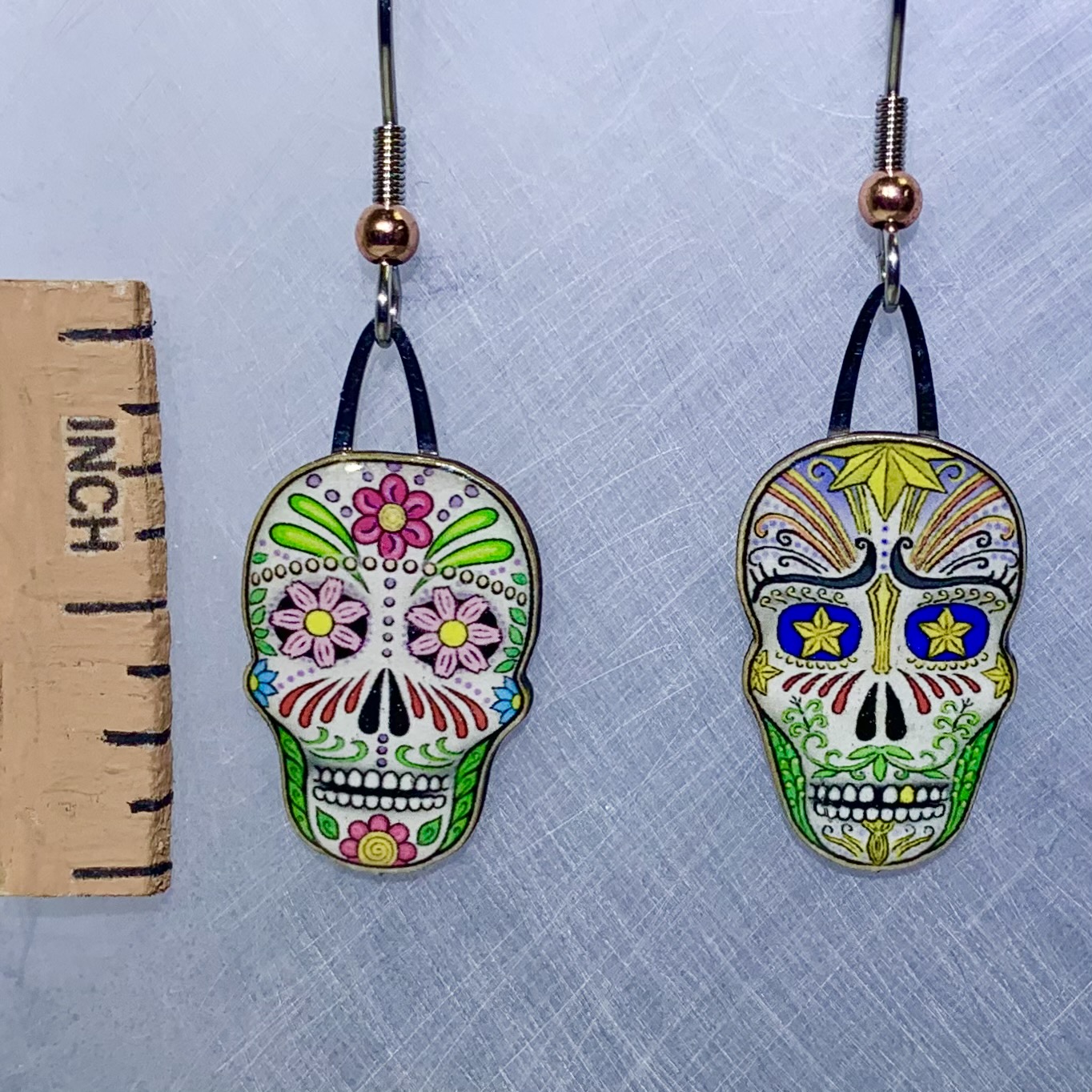 Picture shown is of 1 inch tall pair of earrings of Dia de los Muertos (Sugar Skulls).