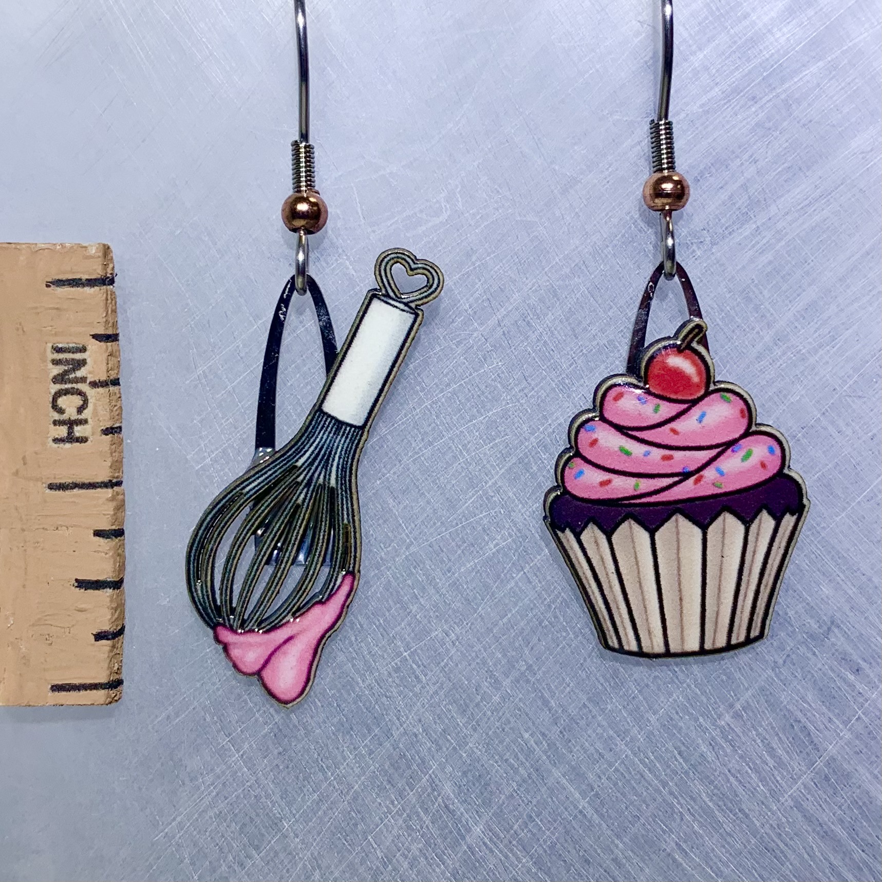 Picture shown is of 1 inch tall pair of earrings of Baking Cupcakes.