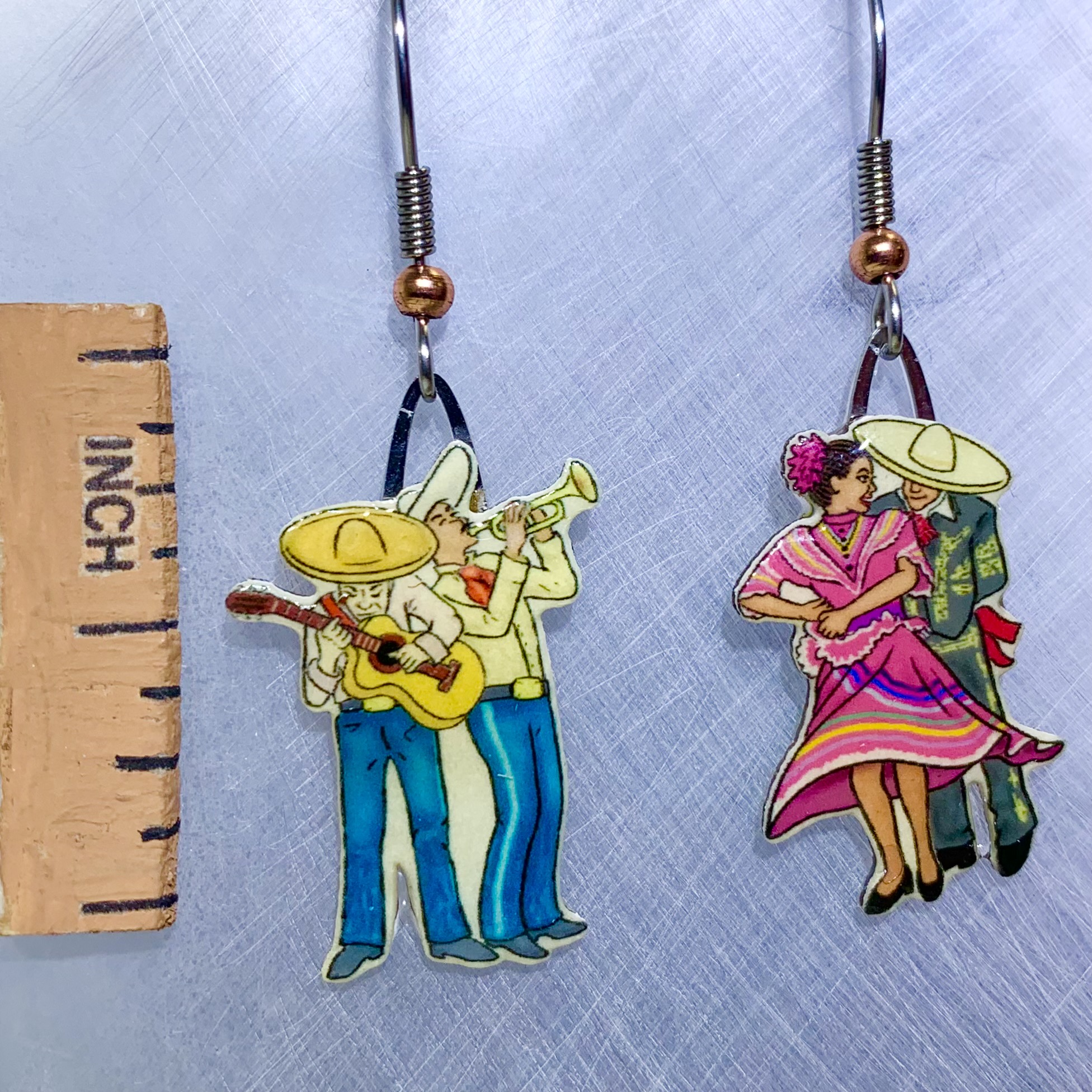 Picture shown is of 1 inch tall pair of earrings of La Fiesta.