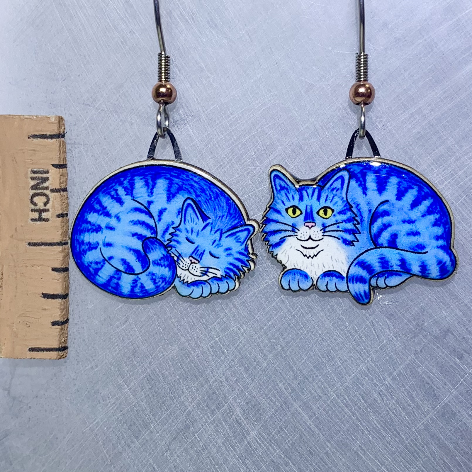 Picture shown is of 1 inch tall pair of earrings of the pet the Blue Napping Cat.