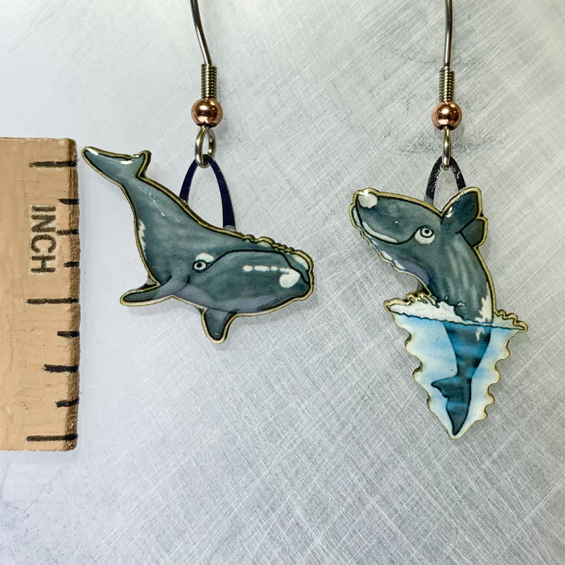 Picture shown is of 1 inch tall pair of earrings of the marine animal the Right Whale.
