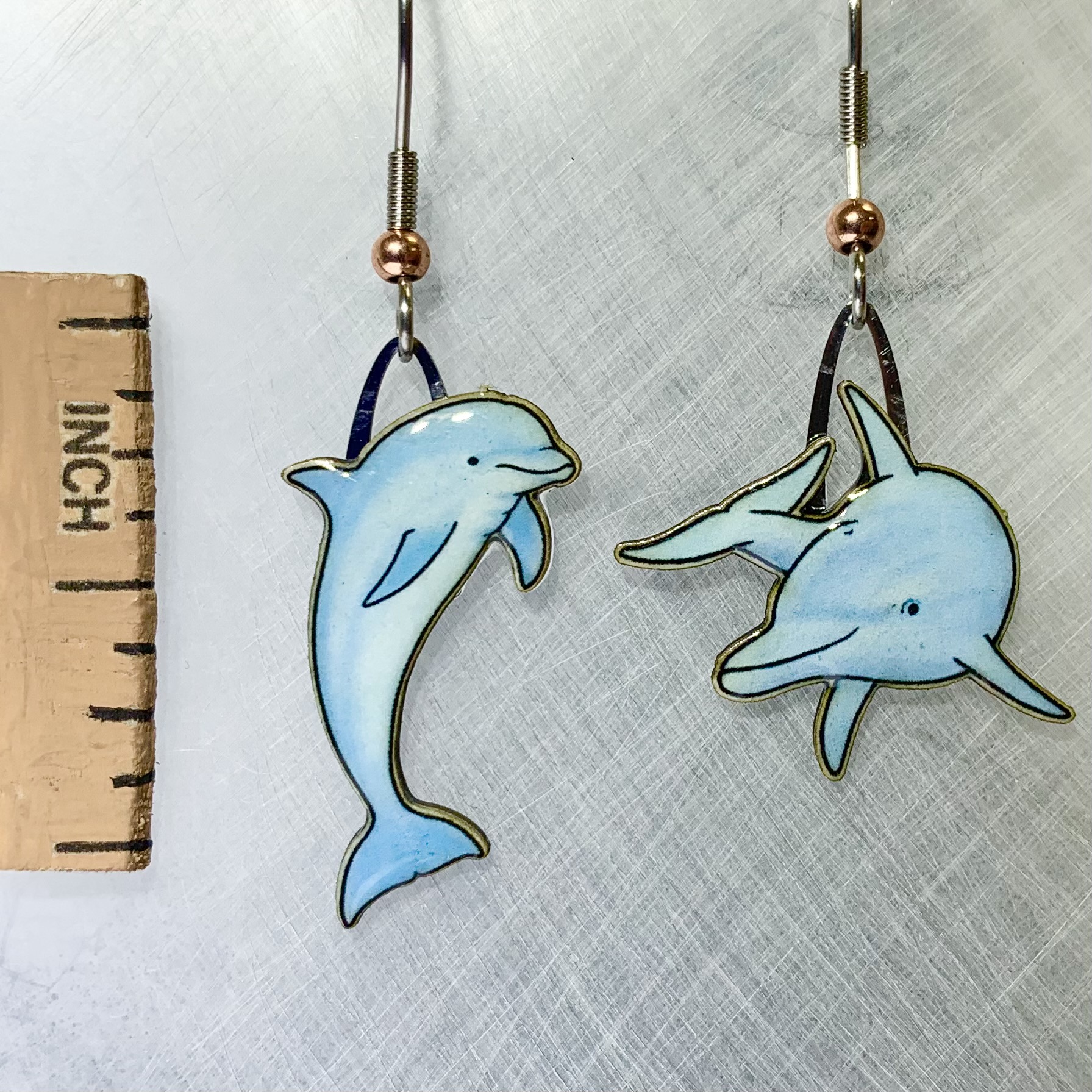 Picture shown is of 1 inch tall pair of earrings of the marine animal the Dolphin.