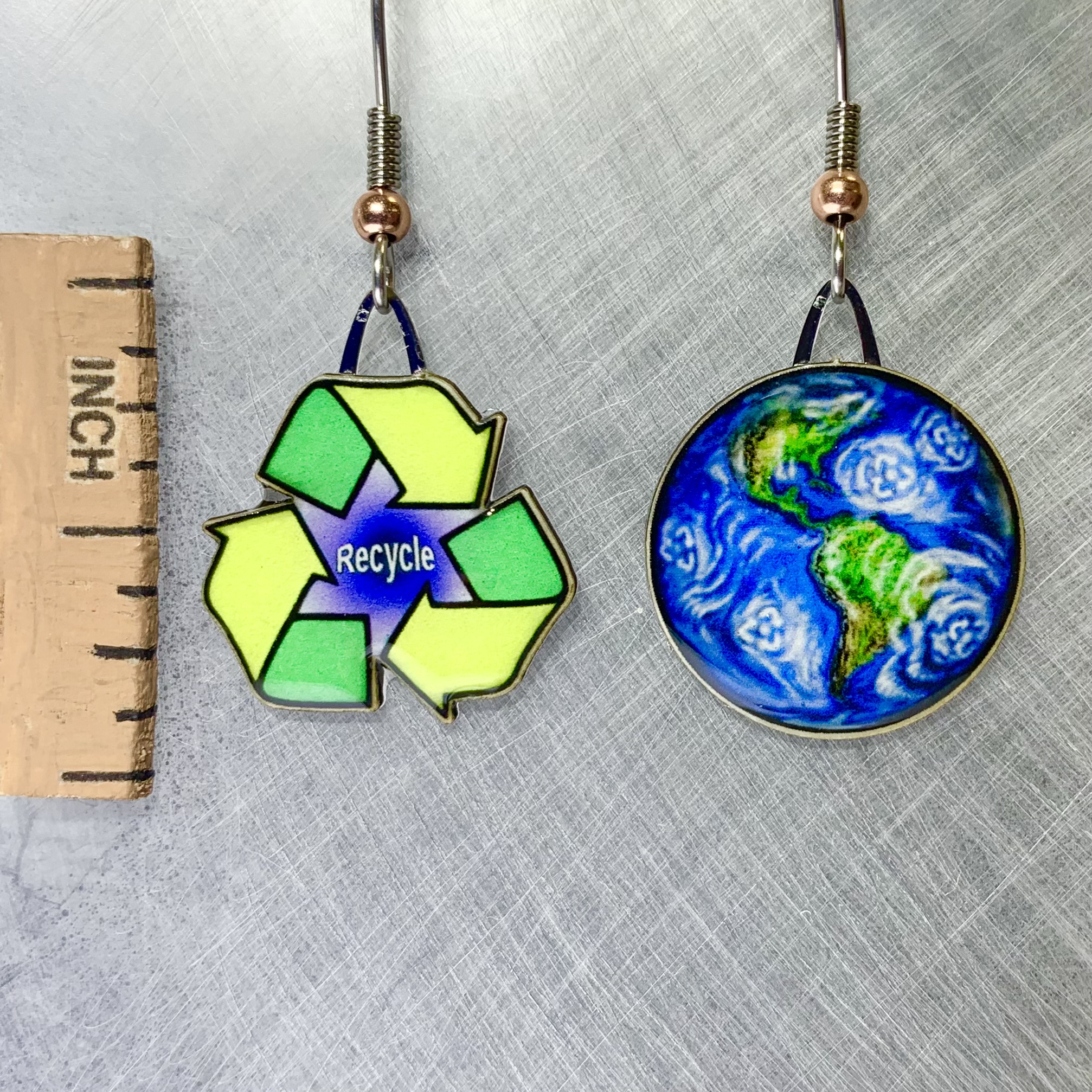 Picture shown is of 1 inch tall pair of earrings of Reduce, Reuse, Recycle.