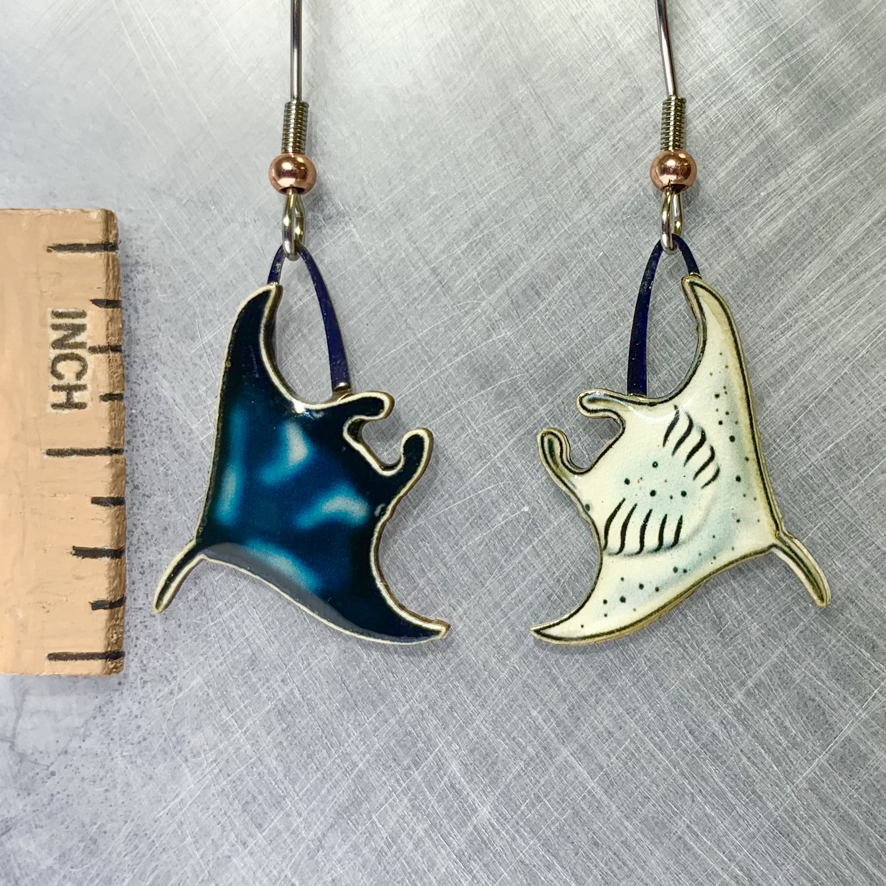 Picture shown is of 1 inch tall pair of earrings of the marine animal the Manta Ray.