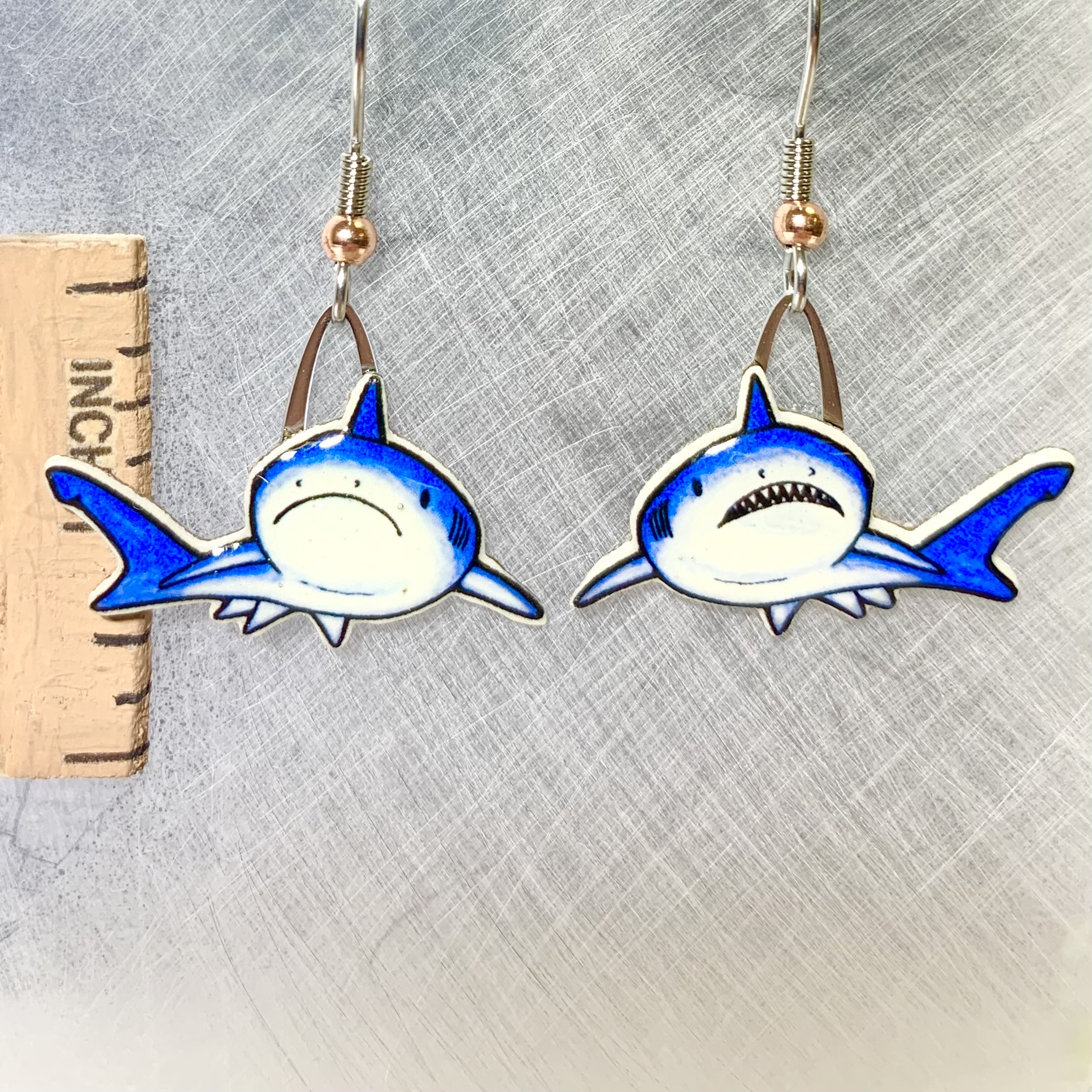 Picture shown is of 1 inch tall pair of earrings of the marine animal the Shark.