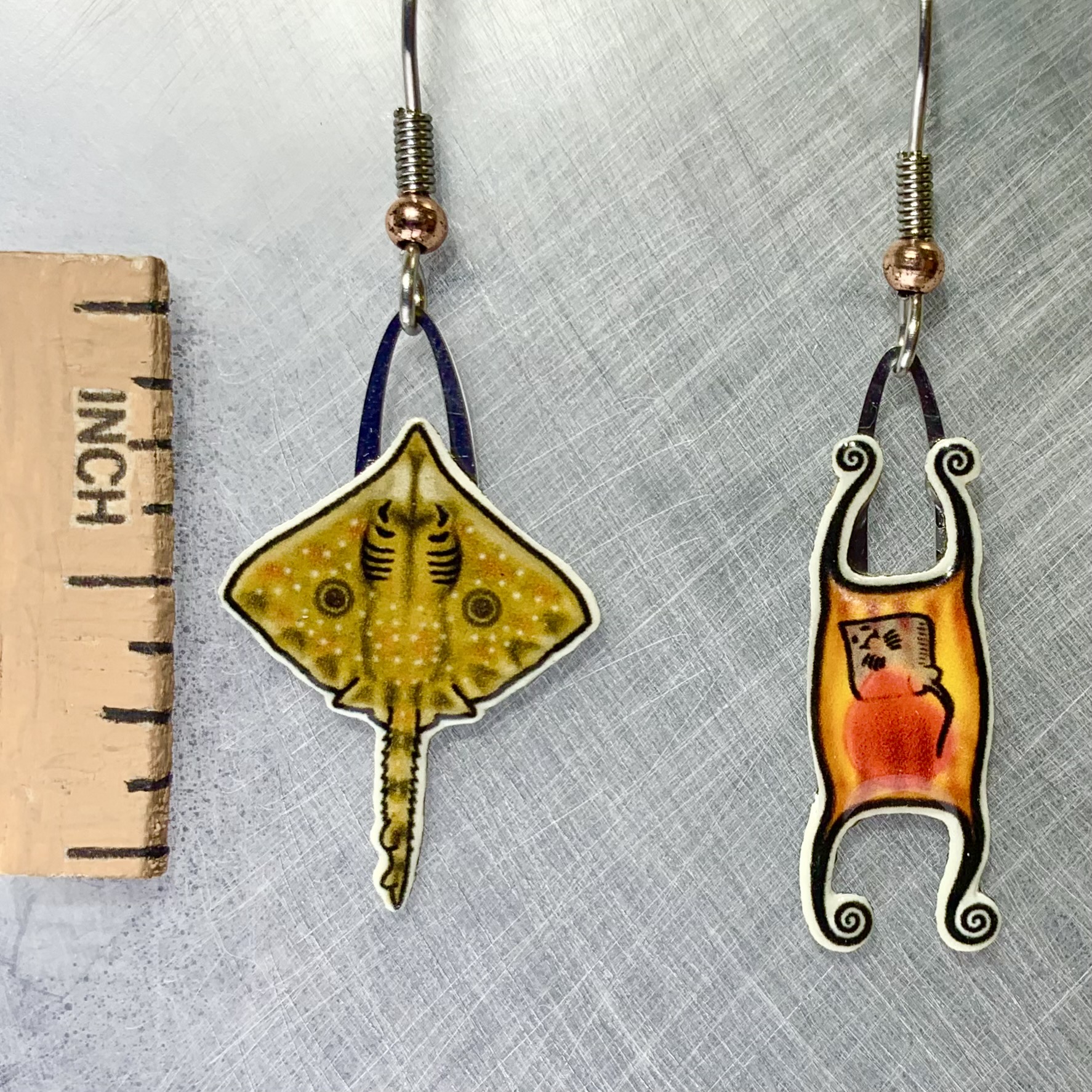 Picture shown is of 1 inch tall pair of earrings of the marine animal the Skate.