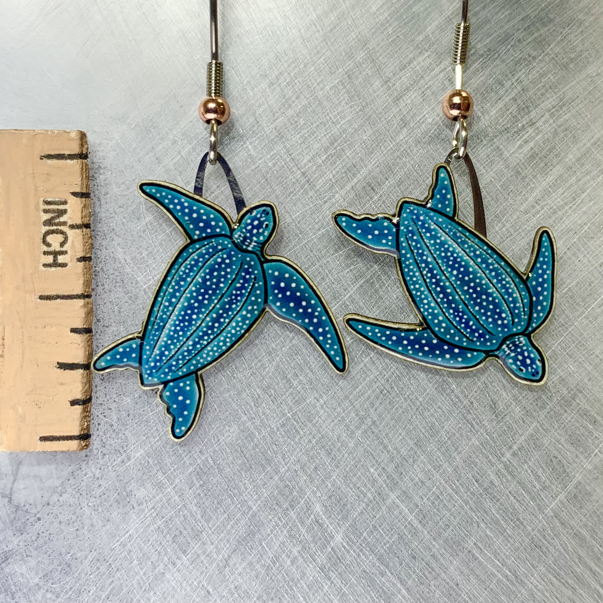 Picture shown is of 1 inch tall pair of earrings of the marine animal the Leatherback Sea Turtle.