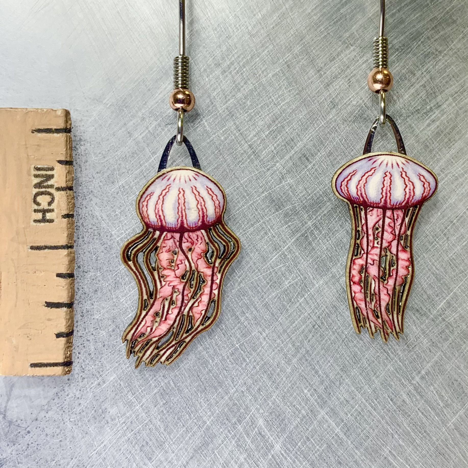 Picture shown is of 1 inch tall pair of earrings of the marine animal the Jellyfish.