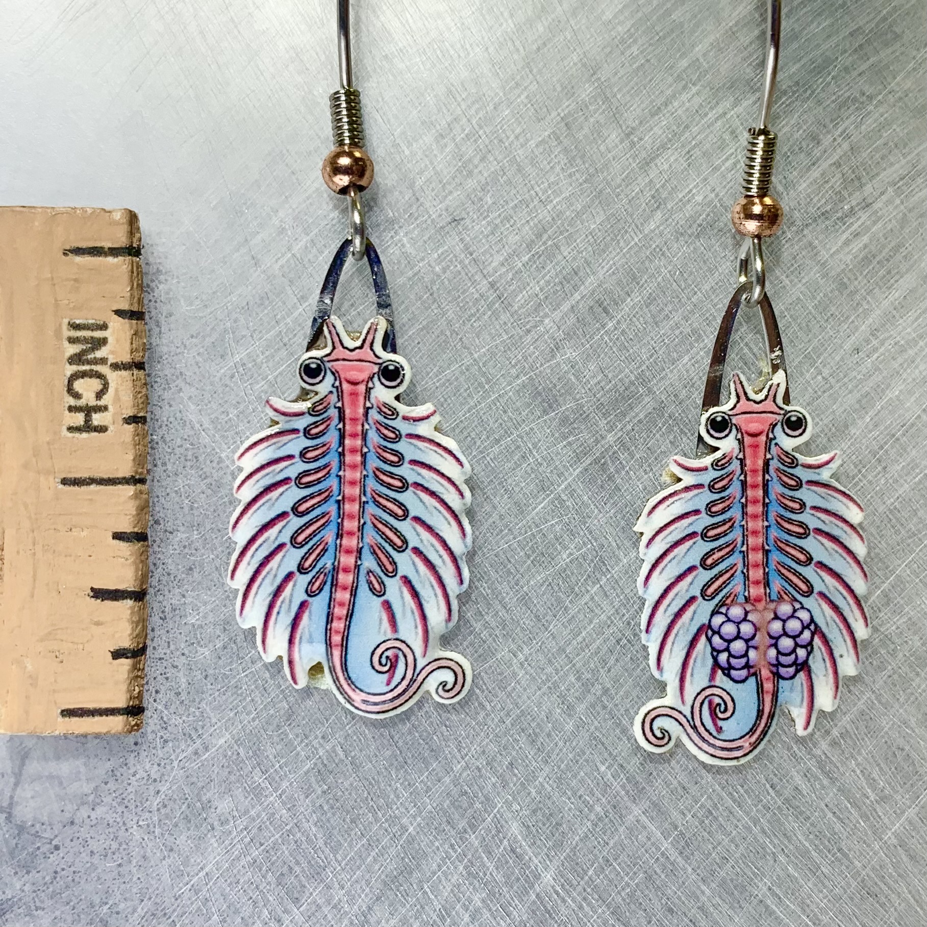 Picture shown is of 1 inch tall pair of earrings of the marine animal the Brine Shrimp.