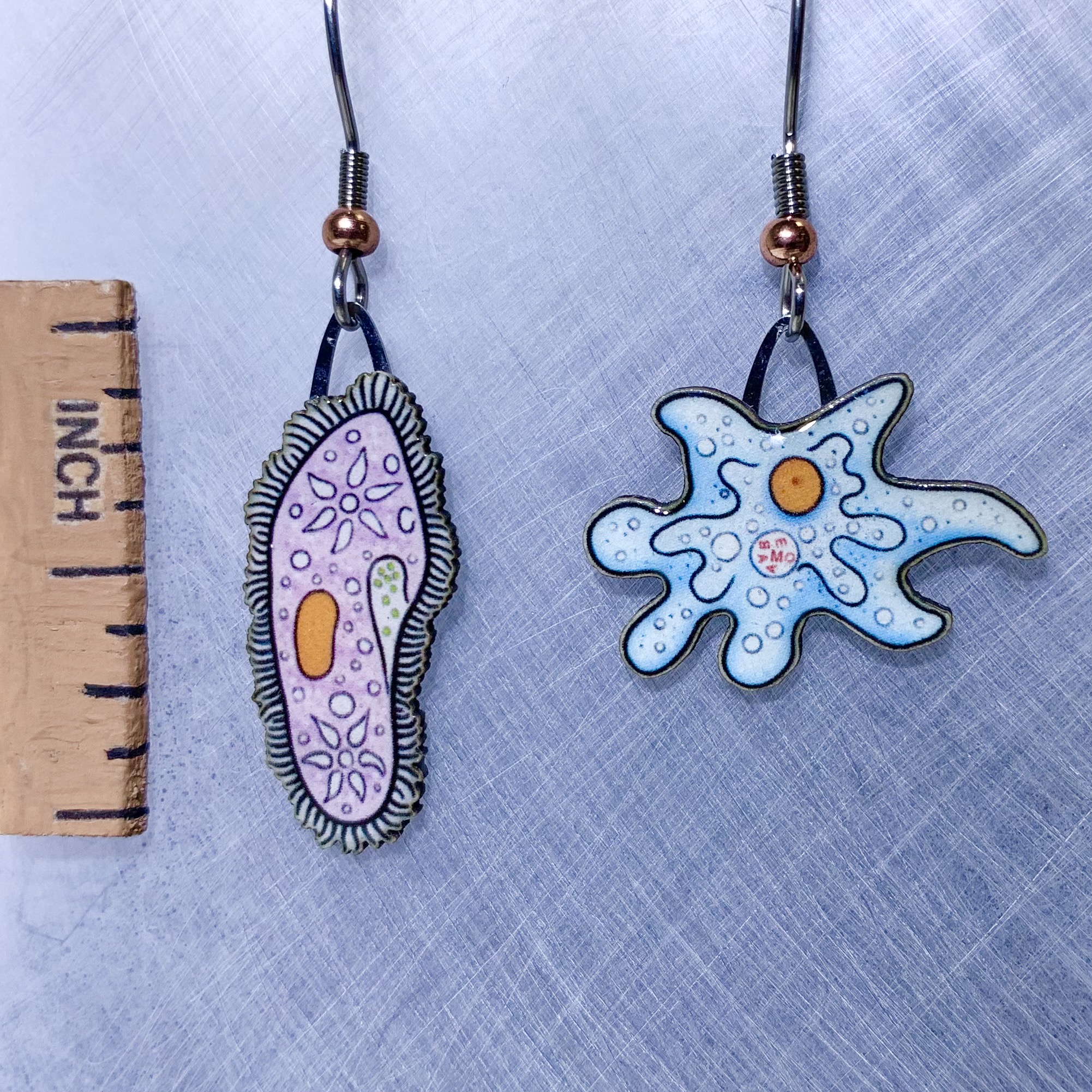 Picture shown is of 1 inch tall pair of earrings of Paramecium & Amoeba.