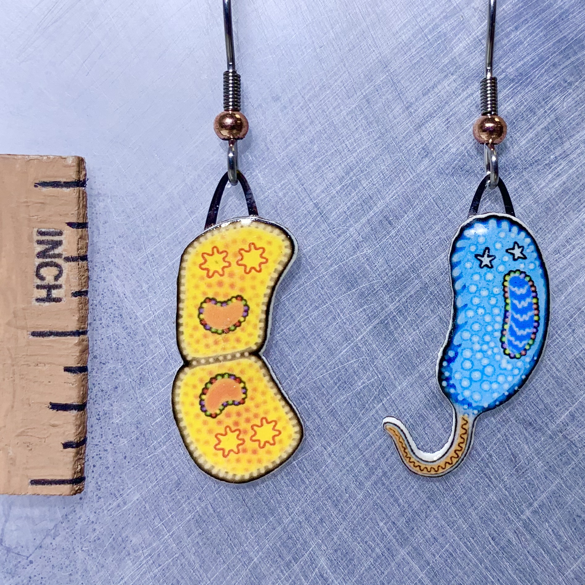 Picture shown is of 1 inch tall pair of earrings of Extremophiles.