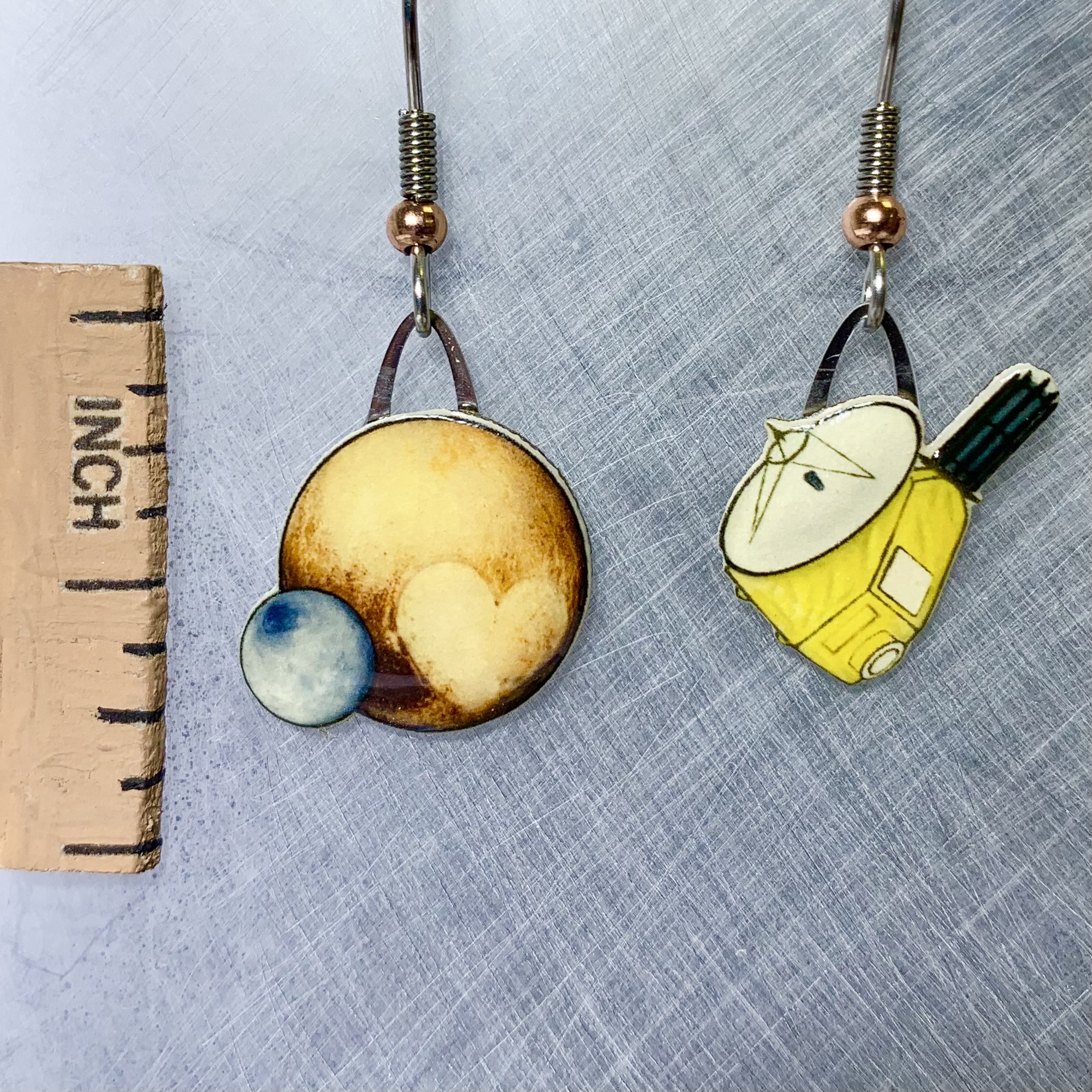 Picture shown is of 1 inch tall pair of earrings of Pluto & New Horizons.