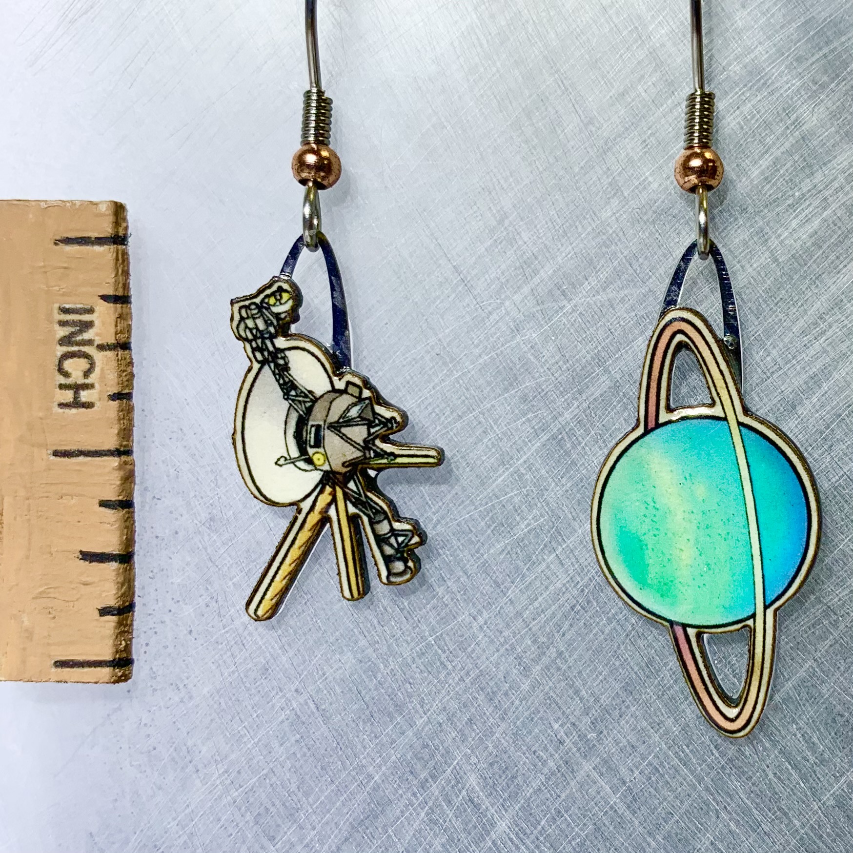 Picture shown is of 1 inch tall pair of earrings of Voyager Uranus Flyby.