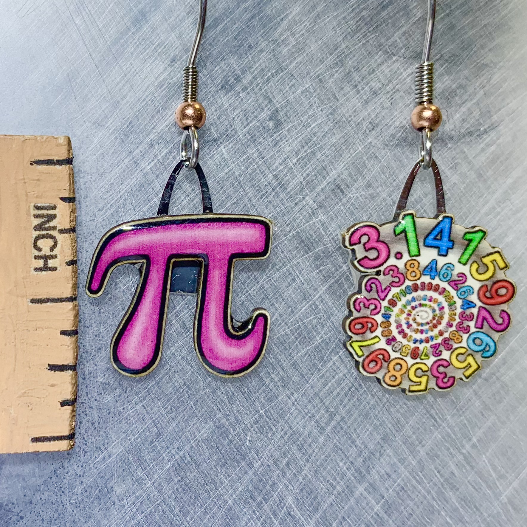Picture shown is of 1 inch tall pair of earrings of the number Pi.