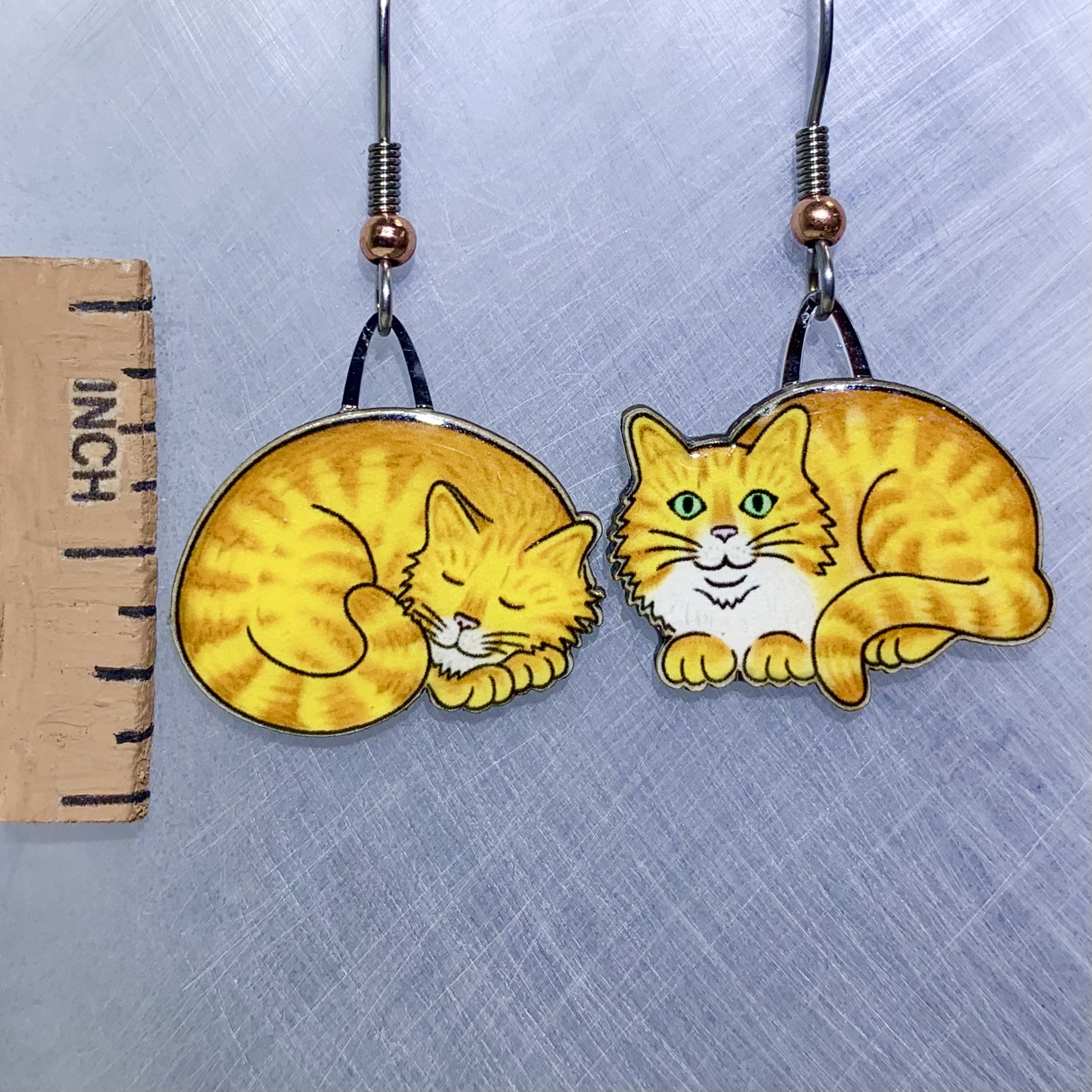 Picture shown is of 1 inch tall pair of earrings of the pet the Yellow Napping Cat.