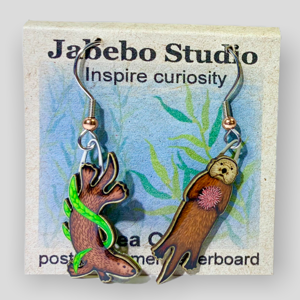 Picture shown is of 1 inch tall pair of earrings of the marine animal the Sea Otter.