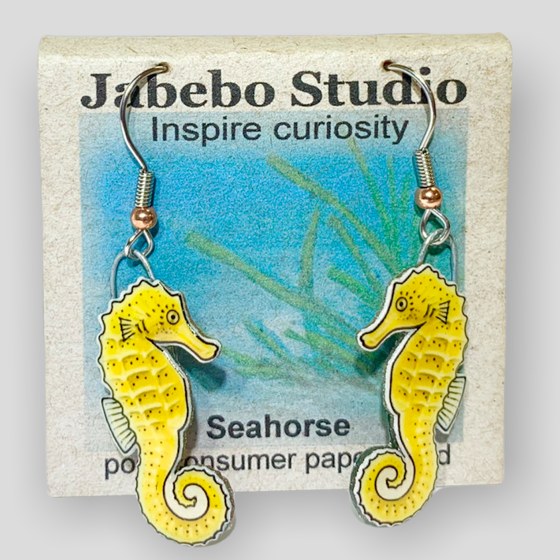 Picture shown is of 1 inch tall pair of earrings of the marine animal the Yellow Seahorse.