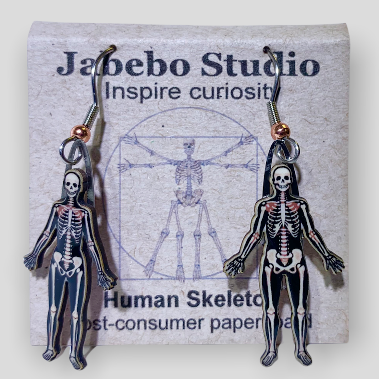 Picture shown is of 1 inch tall pair of earrings of Human Skeletons.