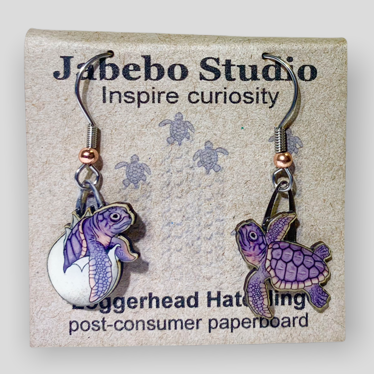 Picture shown is of 1 inch tall pair of earrings of the marine animal the Loggerhead Hatchling.
