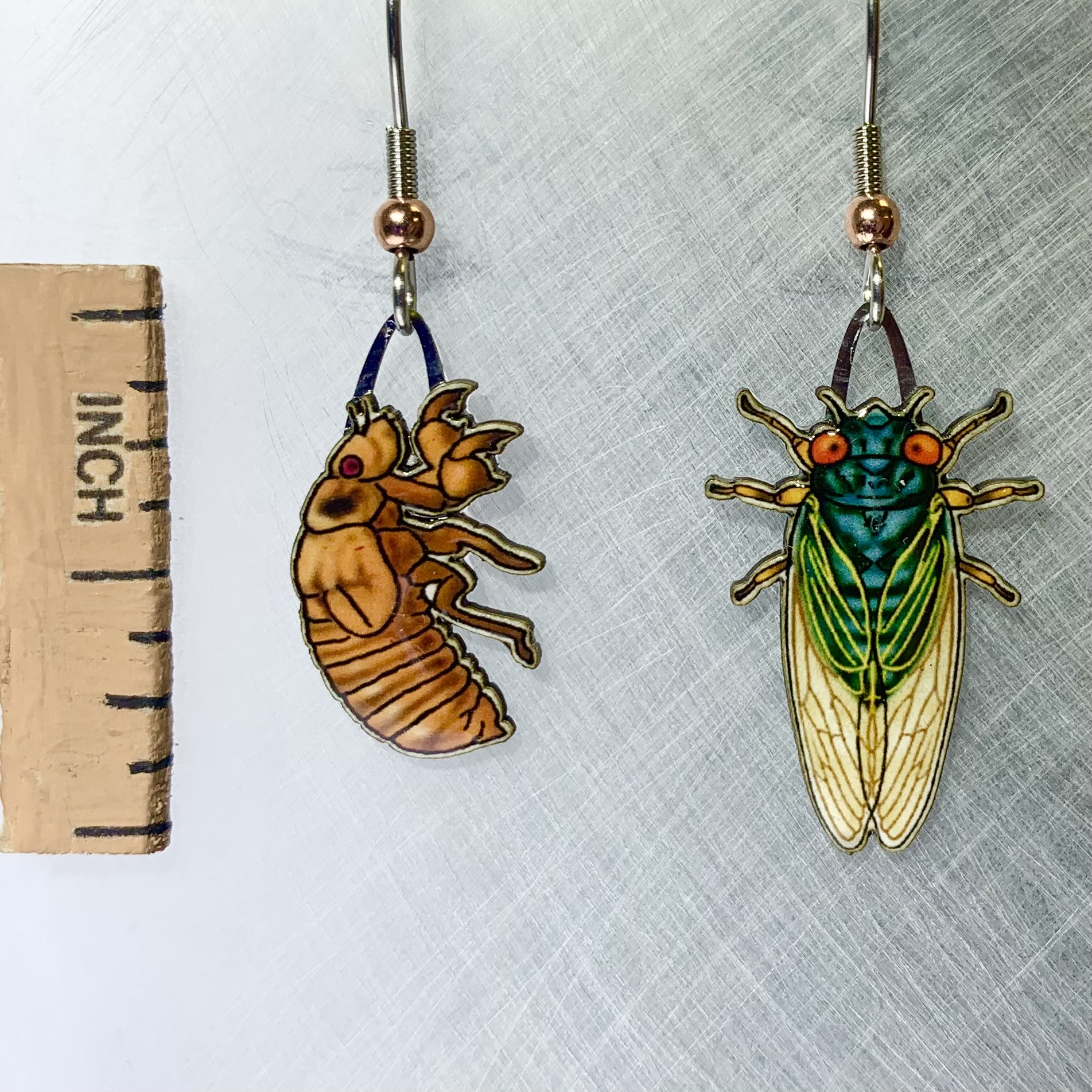 Picture shown is of 1 inch tall pair of earrings of the bug the Cicada.