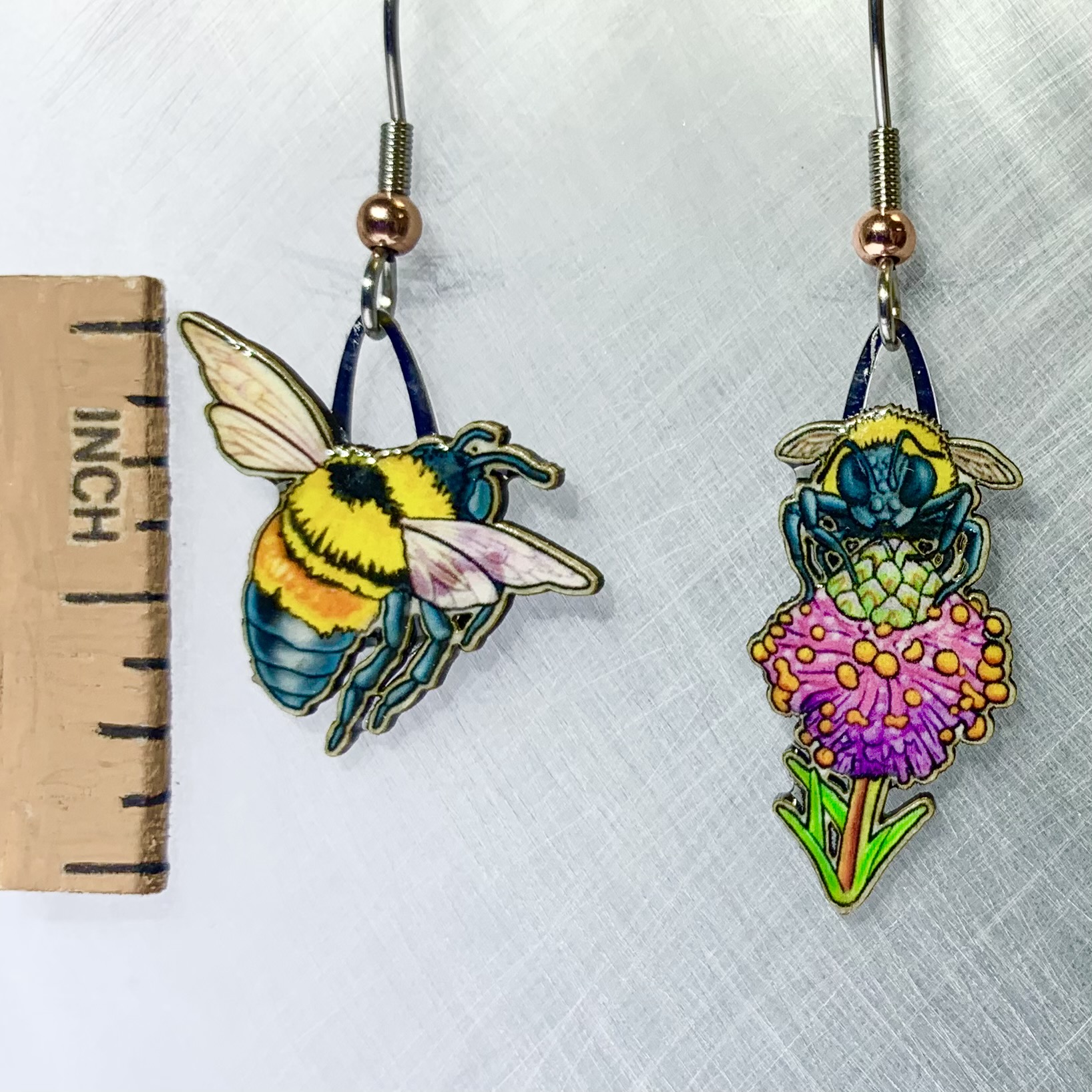 Picture shown is of 1 inch tall pair of earrings of the bug the Rusty-Patched Bumble Bee.