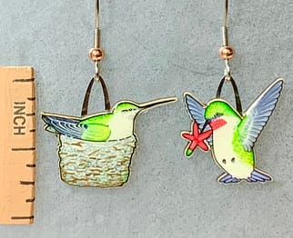 Picture shown is of 1 inch tall pair of earrings of a hummingbird & nest.