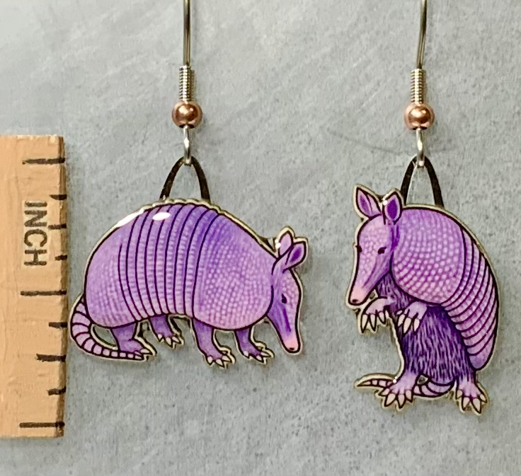 Picture shown is of 1 inch tall pair of earrings of the animal the Nine-banded Armadillo.
