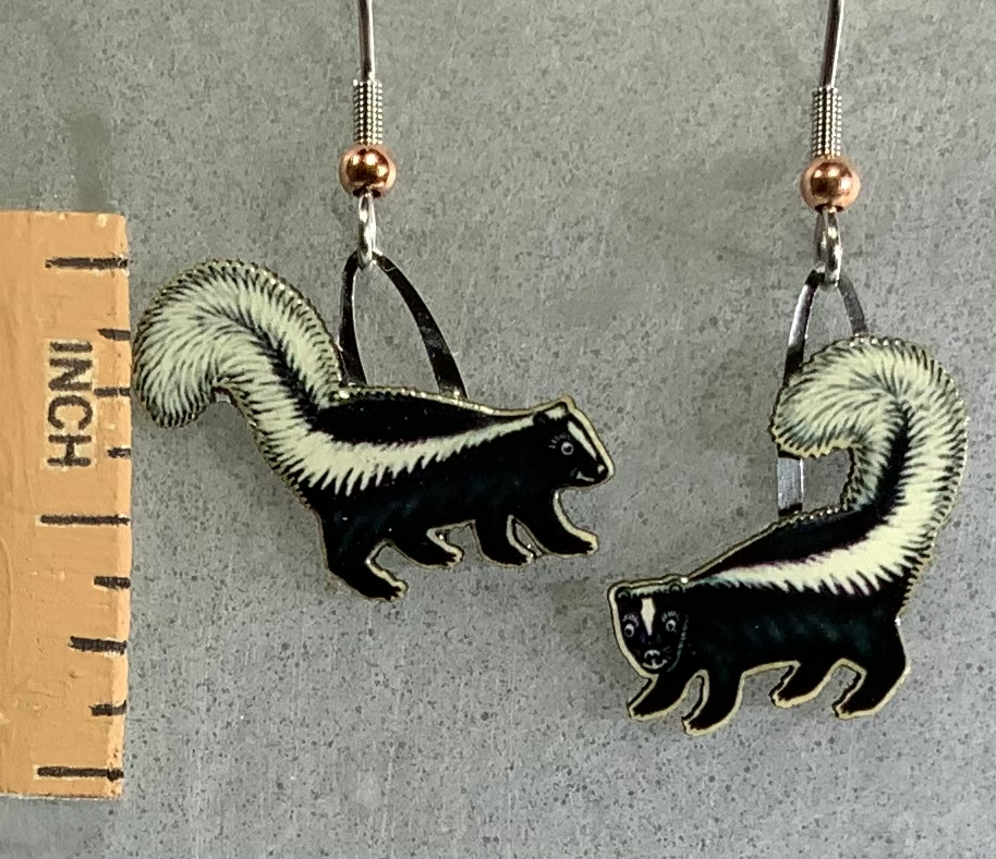 Picture shown is of 1 inch tall pair of earrings of the animal the Striped Skunk.